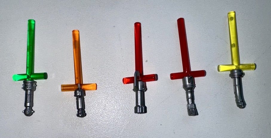 Multiple cross-guard style lightsabers lined up