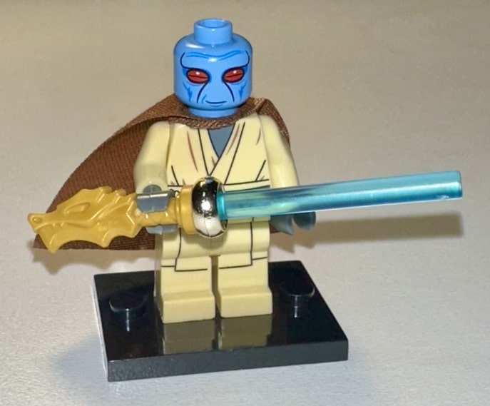 Duros spacer wielding a melee weapon aboard a starship corridor