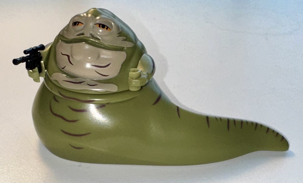 Hutt crime boss wielding a blaster.