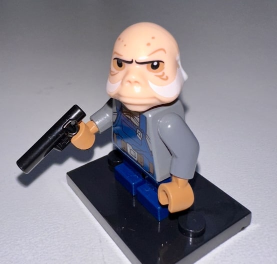 Ugnaught weilding a blaster pistol