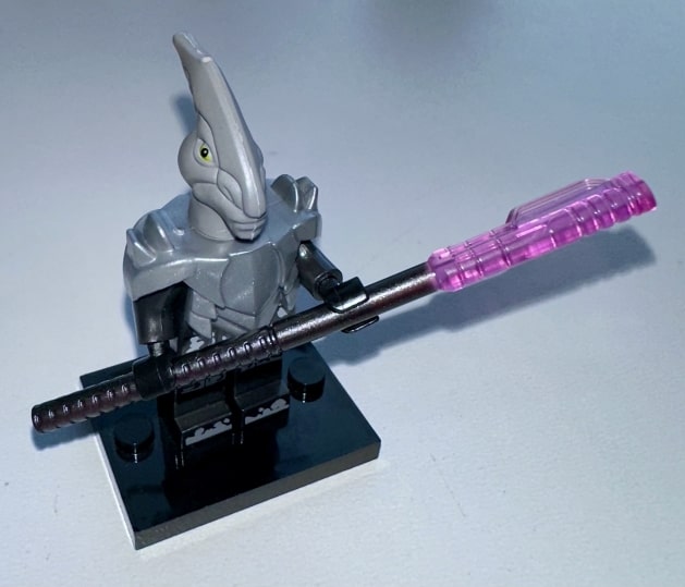 Vurk warrior wearing heavy armor and weilding an electro-staff