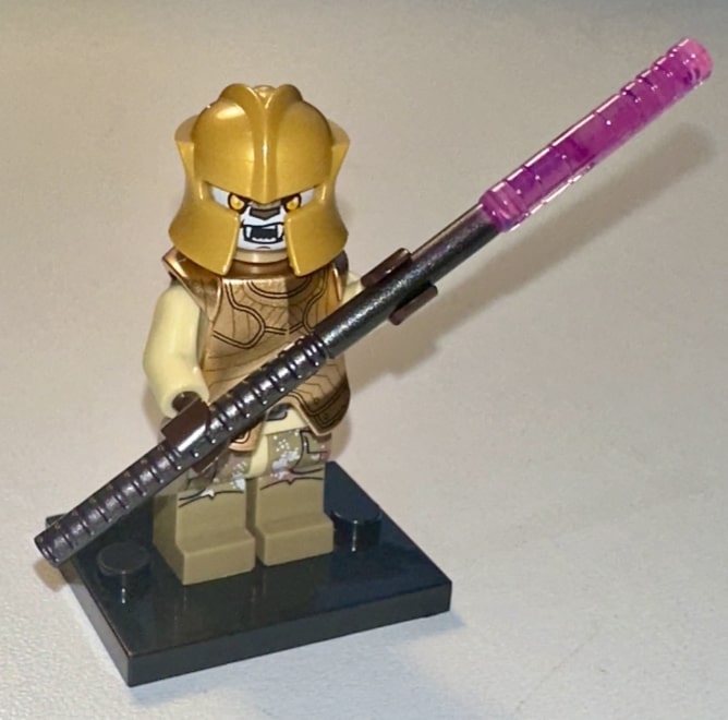 Zygerrian with an electro-staff in traditional Zygerrian armor