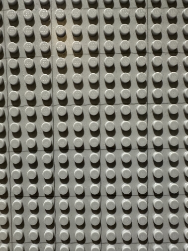 LEGO baseplate showing the 3x3 stud grid used as SWURPG movement squares